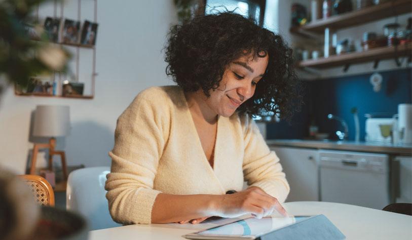 Buy Now Pay Later article image A woman scrolls through an iPad