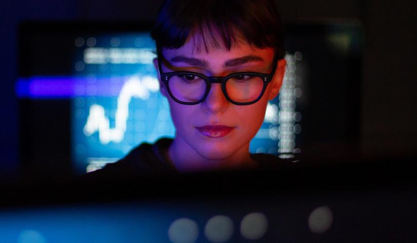 Investment hype image A person works on a computer.